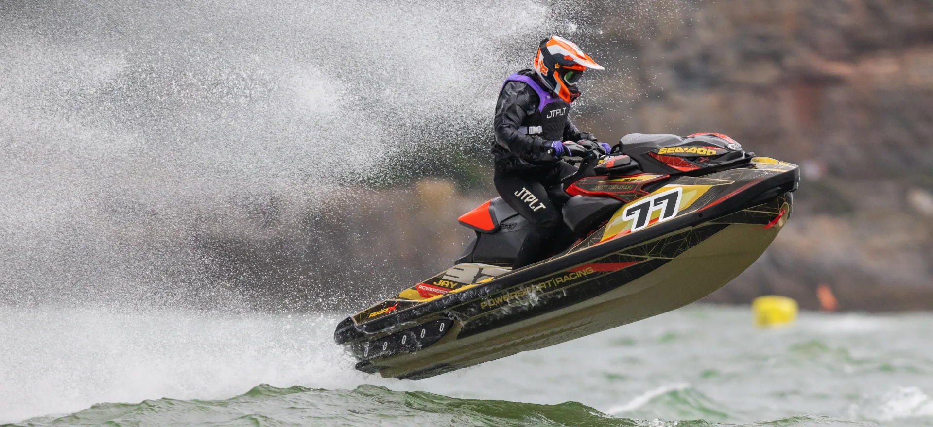 Sea-Doo race jetski airborne with black, gold and red custom sticker kit — S3R Designs