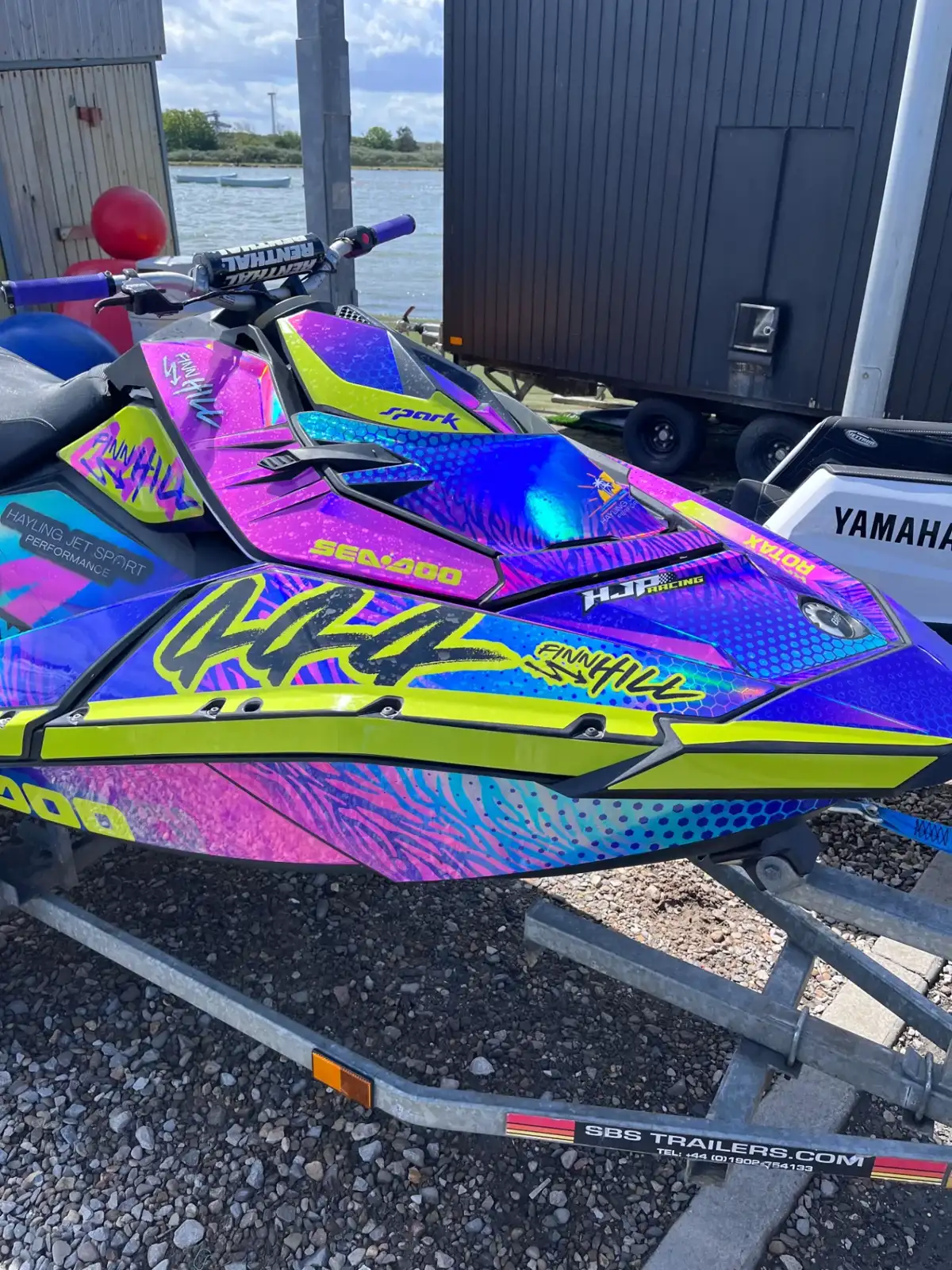 Close-up of holographic pink, purple and lime Sea-Doo Spark sticker kit