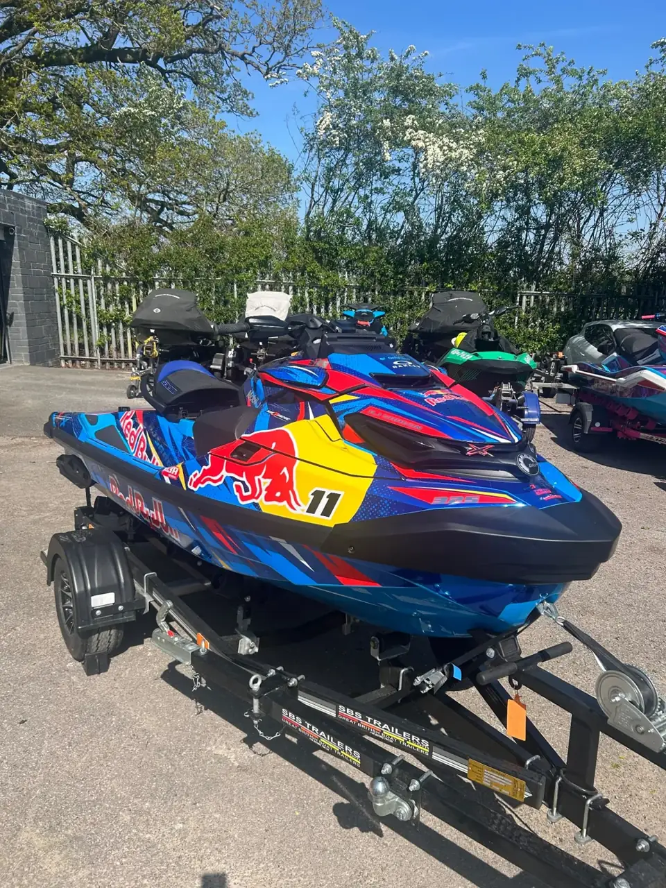 Red Bull style blue and red Sea-Doo RXP-X 325 sticker kit on trailer