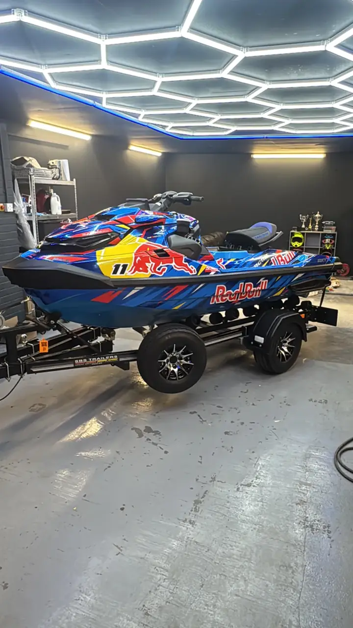 Side profile of blue and red Sea-Doo RXT-X custom sticker kit